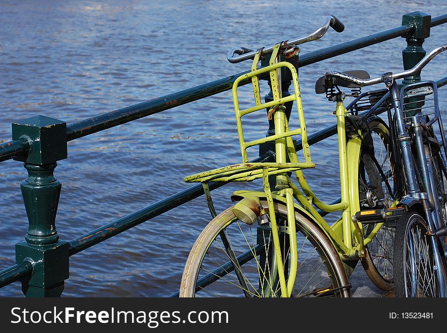 Two bikes at a waterway in Amsterdam