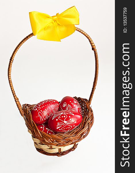 Easter egg basket with yellow ribbon on white background. Easter egg basket with yellow ribbon on white background