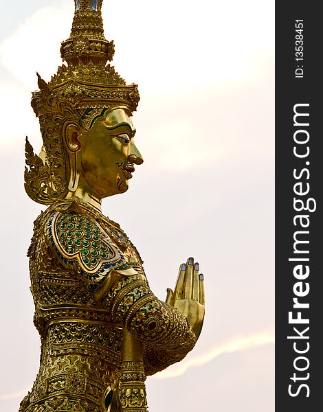 The guardian angel statue standing before a pagoda, Amphawa, Thailand