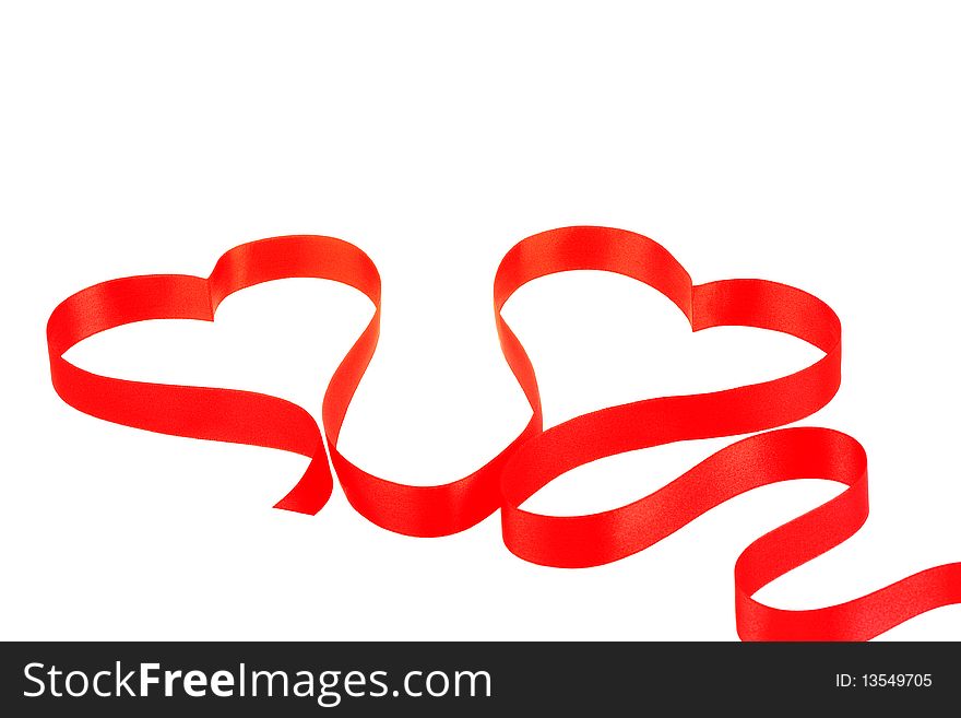 Two hearts from red ribbon isolated on white background