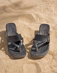 Pair Of Sandals On The Beach Stock Photos Pair Of Sandals On The Beach Stock Photos