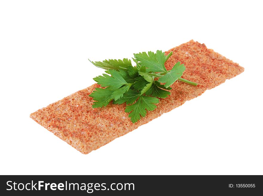 Thin crispbread with parsley isolated on white background