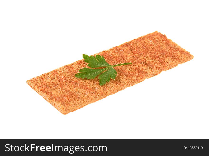 Thin crispbread with parsley isolated on white background