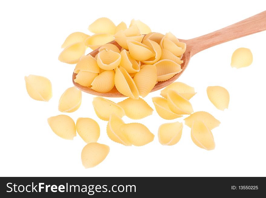 Italian pasta in a wood spoon isolated on white background