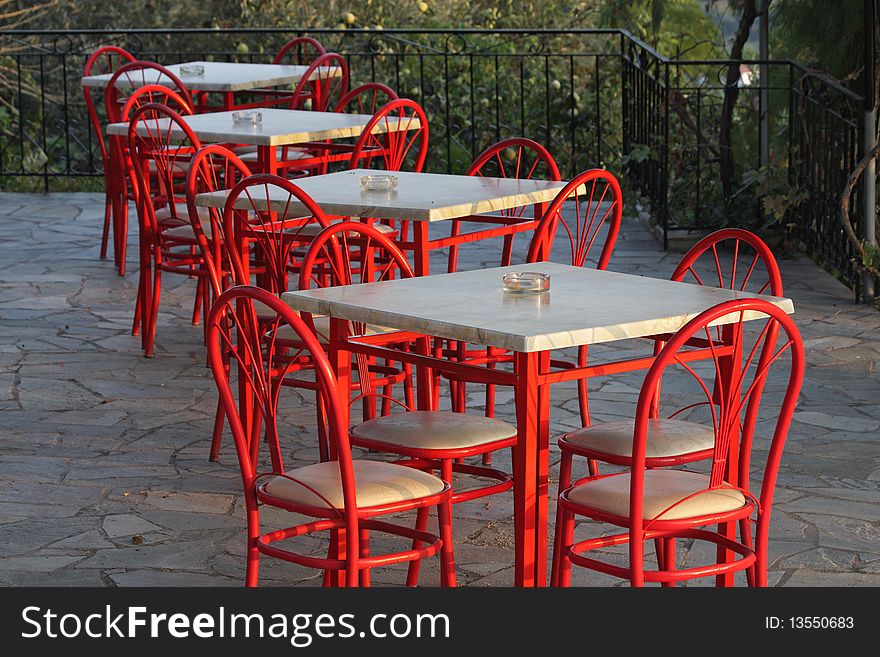 Still life with red chairs and tables, Lesbos, Greece