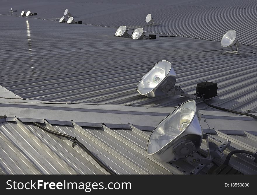 Halogen and filement lights or lamps on metal roof to light up roof. Halogen and filement lights or lamps on metal roof to light up roof