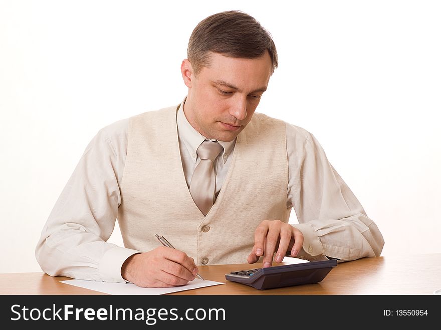 Young handsome businessman finds a table on a white background