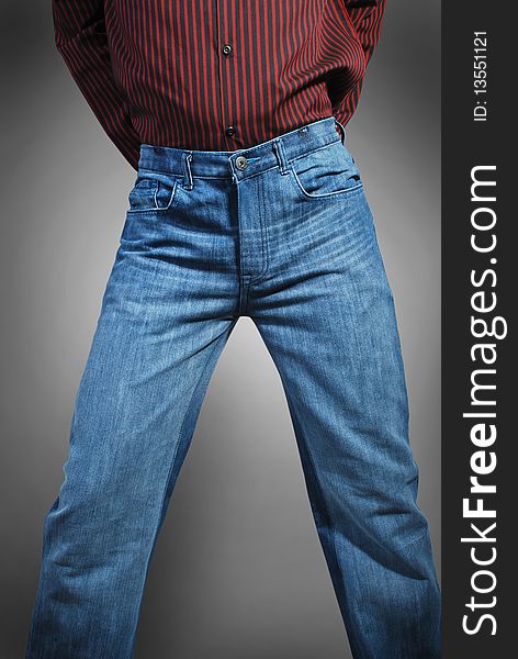 Beautiful blue jeans and red shirt wearing a model isolated on a gray background.