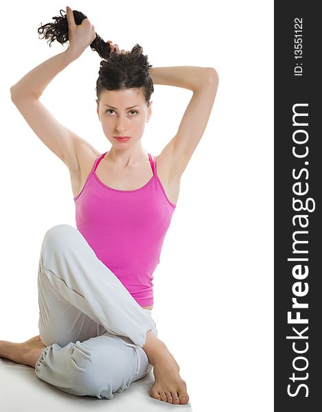 Young woman preparing for doing fitness exercise on white background