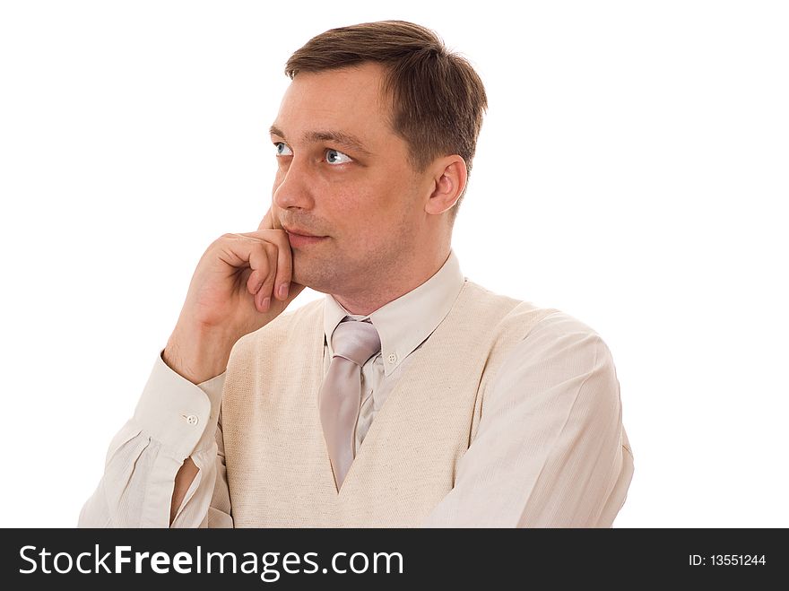 Young serious businessman standing on white background