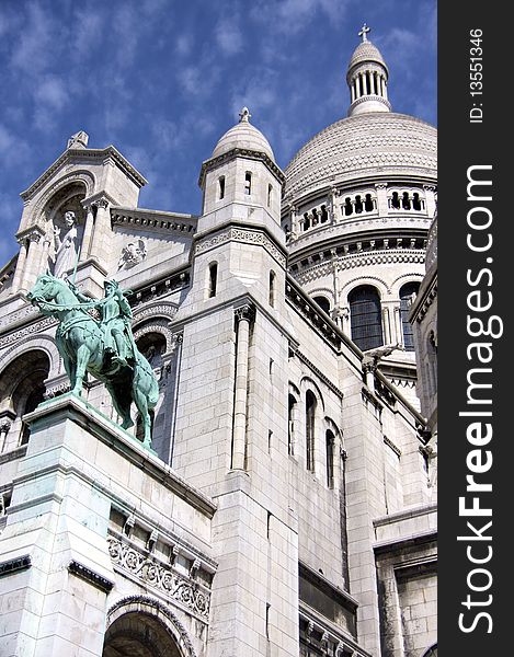 Vertical view of Sacre Coeur Temple in Paris France on Sunny Day in Butte Montmartre. Vertical view of Sacre Coeur Temple in Paris France on Sunny Day in Butte Montmartre