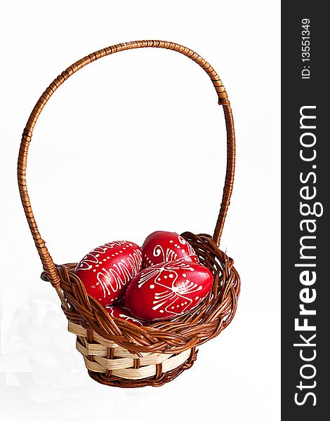 Easter eggs in a basket on white background. Easter eggs in a basket on white background