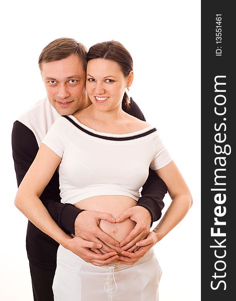Pregnant Woman Standing Next To Her Husband