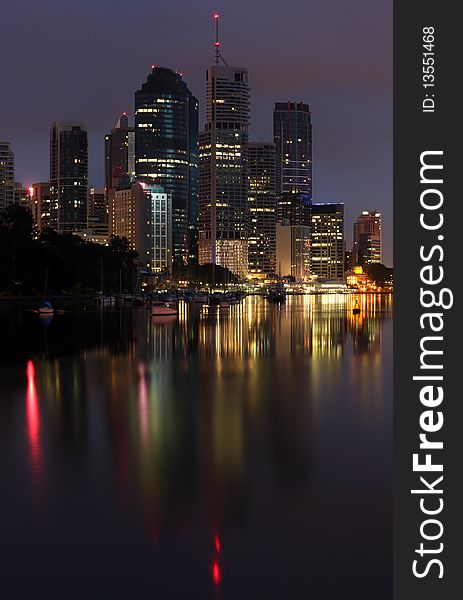 The City of Brisbane reflected in the Brisbane River including Riparian Plaza, the Australian city's icon. The City of Brisbane reflected in the Brisbane River including Riparian Plaza, the Australian city's icon.