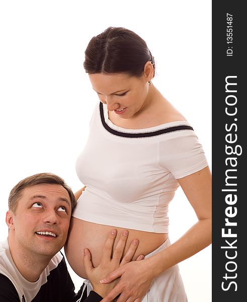 Man And Pregnant Wife On A White