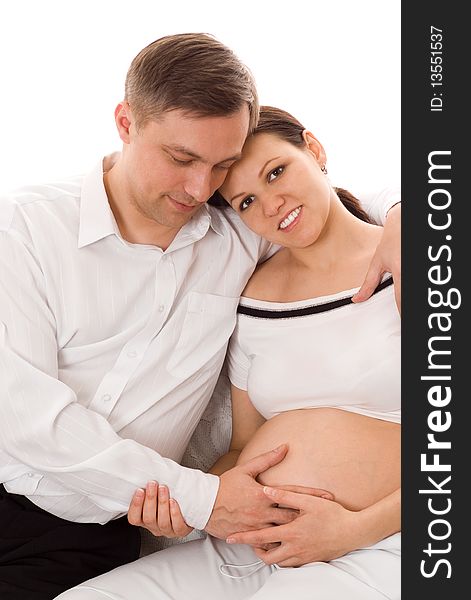 Young man with his pregnant wife were sitting. Young man with his pregnant wife were sitting