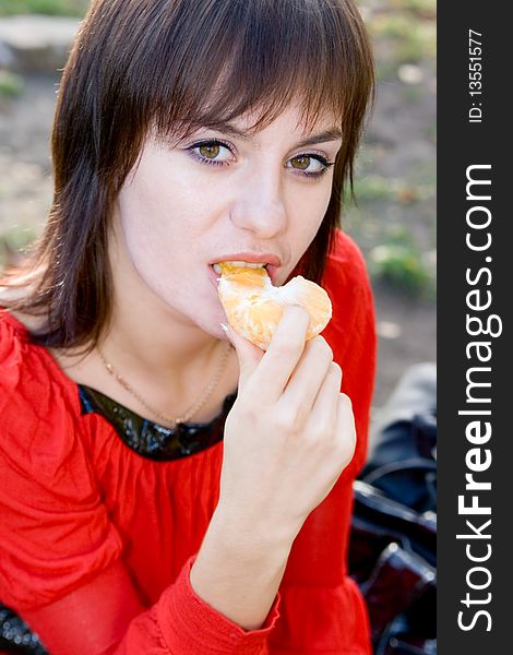 Portrait young girl with orange outdoor