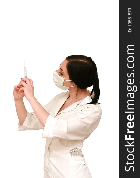 Doctor in a white robe and a mask with syringe. Doctor in a white robe and a mask with syringe