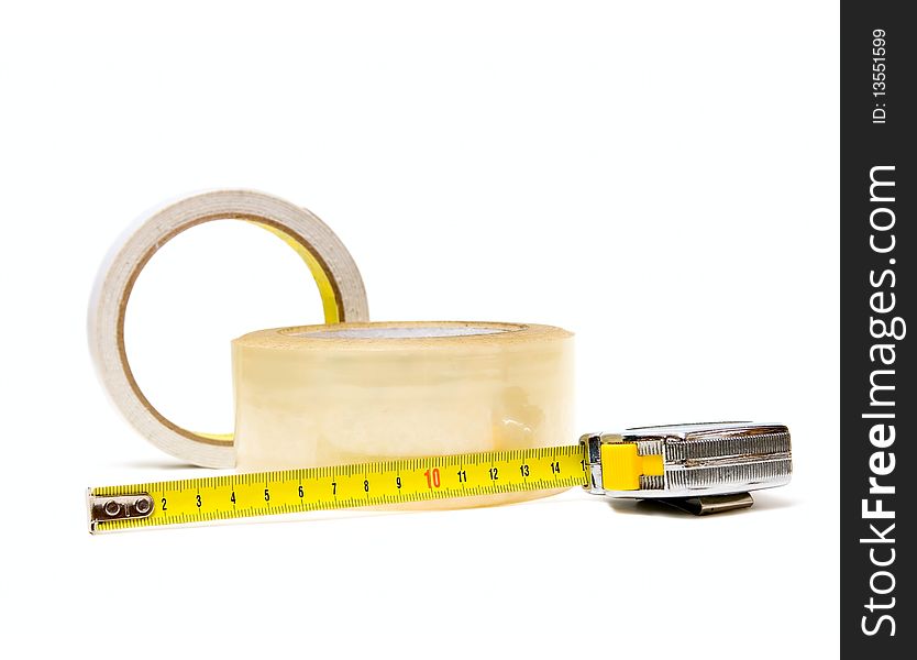 Scotch tape and tape-measure isolated on white