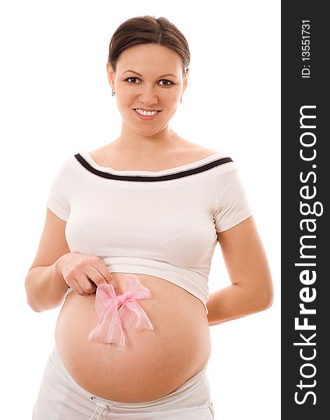 Beautiful pregnant woman holding a bow on his stomach