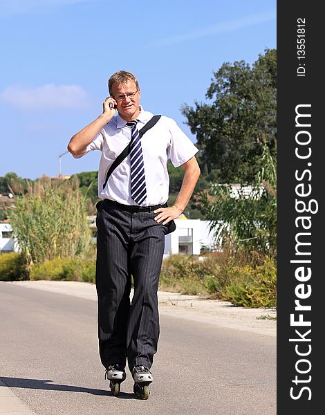 A young businessman with a roller skate