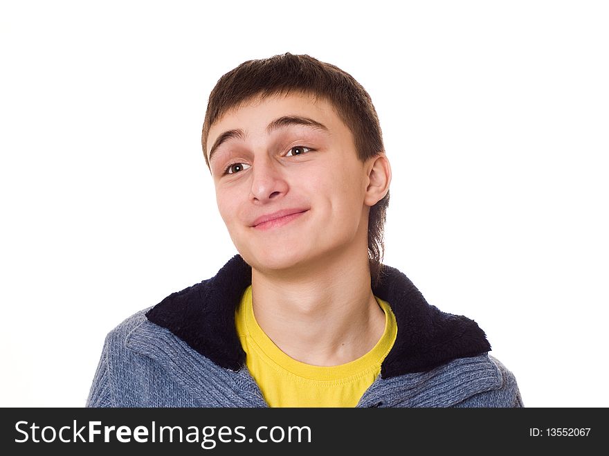 Beautiful teenager standing and smiling on a white background