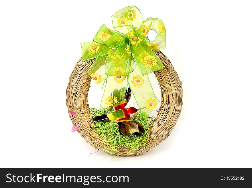 Easter wreath with green ribbon and red bird isolated on white