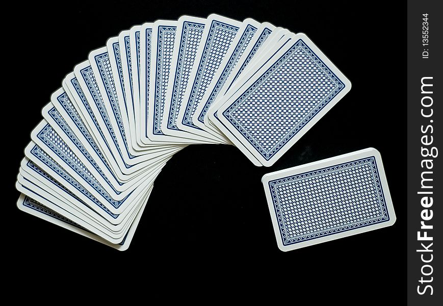 Playing cards on the black background