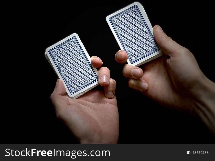 Playing cards on the black background