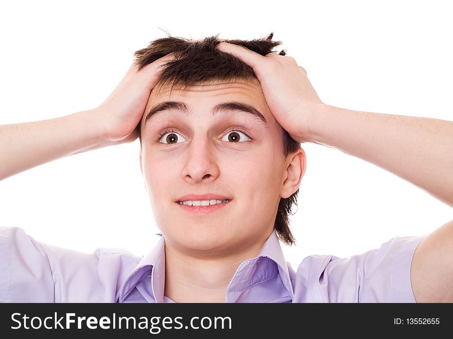 Beautiful teenager in a purple shirt standing against a white