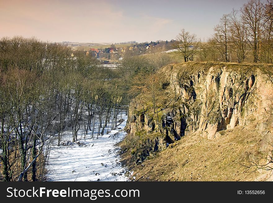 View from the cliff into a ravine in the winter