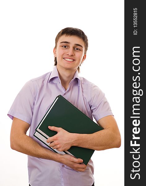 Handsome young student holds a book on white background