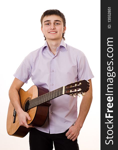Handsome young student with a guitar on a white background