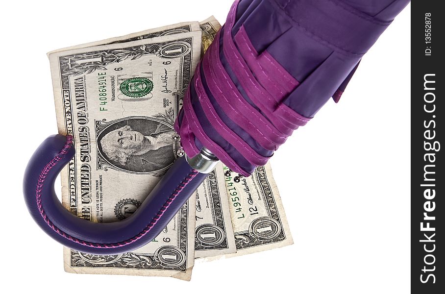 Save Money for a Rainy Day! Purple umbrella and American currency isolated on white with a clipping path.