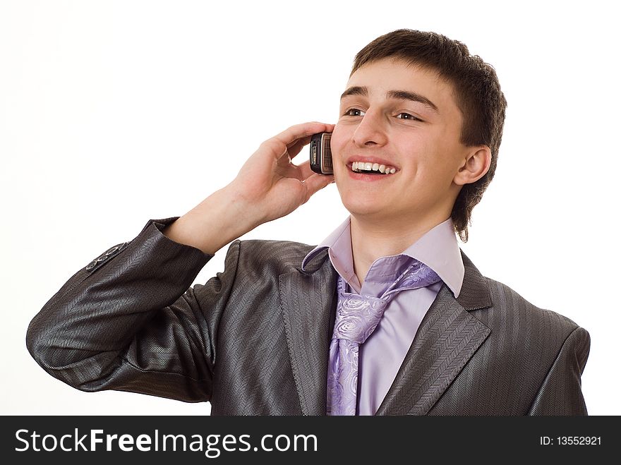 Handsome businessman talking on the phone on a white background