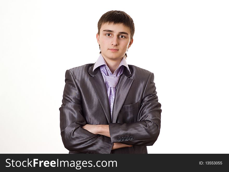 Handsome young businessman standing on white