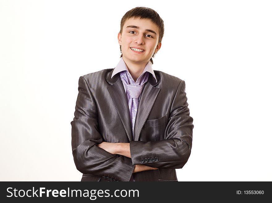 Handsome young businessman standing on white