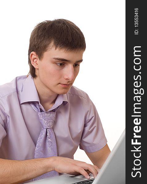 Portrait of a handsome businessman in a purple shirt for a laptop on a white