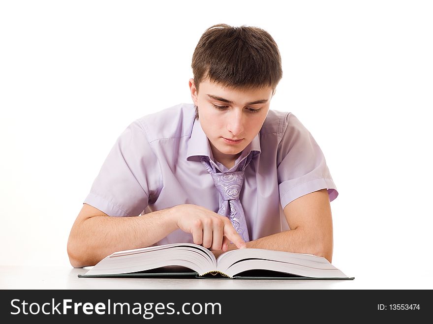 Portrait of a handsome businessman in a purple shirt with a book on white background
