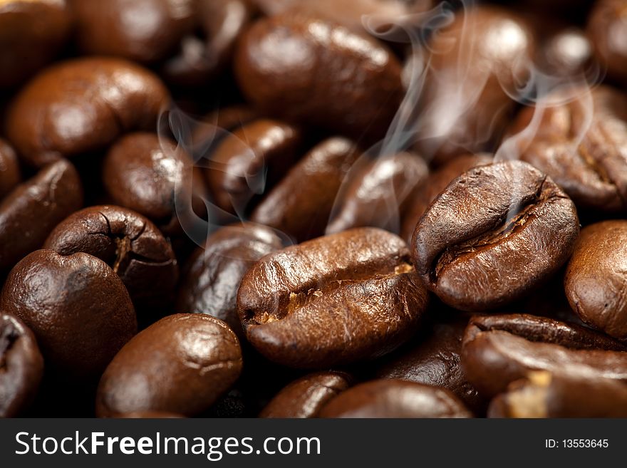 Hot roasted coffee beans background