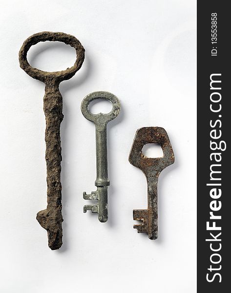 Three vintage rusty keys, closeup image. Three vintage rusty keys, closeup image