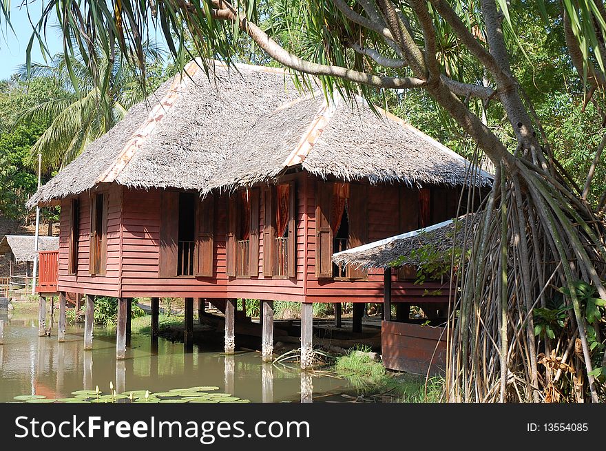 A wooden house at the lake or water