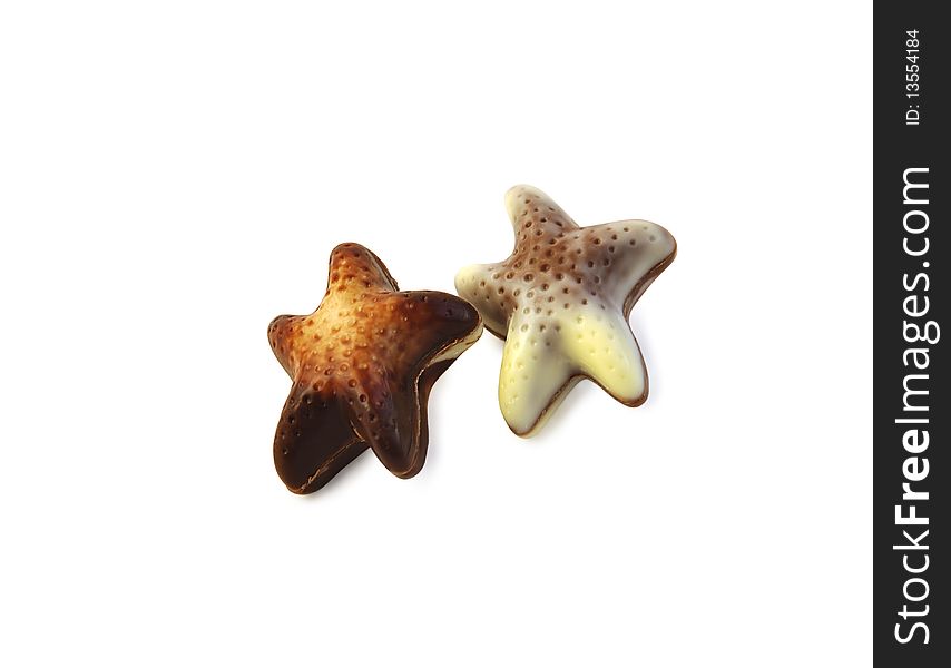 Two chocolate sea stars isolated over white with clipping path. Two chocolate sea stars isolated over white with clipping path.