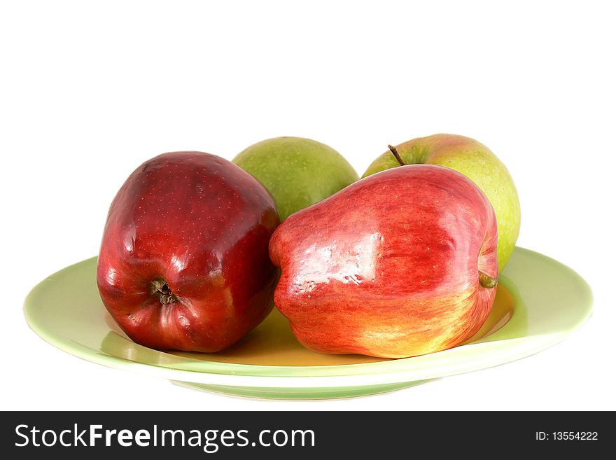 Apples on the plate, isolated on the white