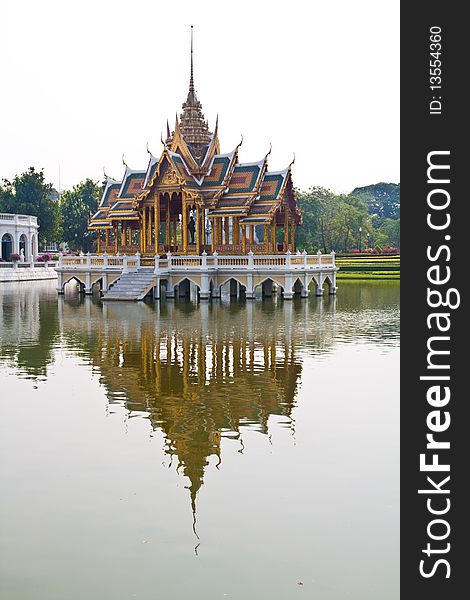 A royal pavilion at Bang-pa-in palace, Thailand, with reflection