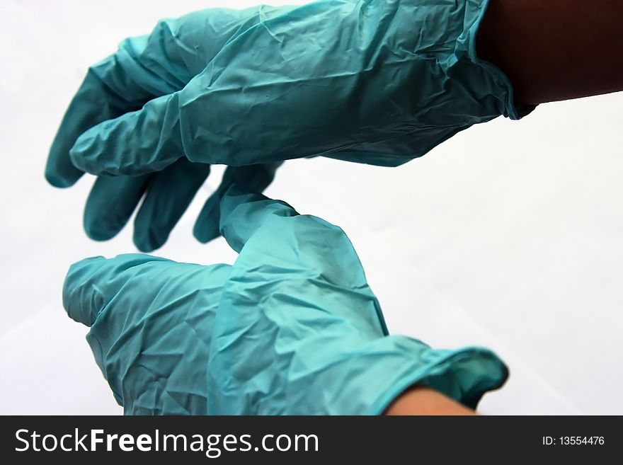 Doctor hands with surgical gloves trying to help the patient. Doctor hands with surgical gloves trying to help the patient