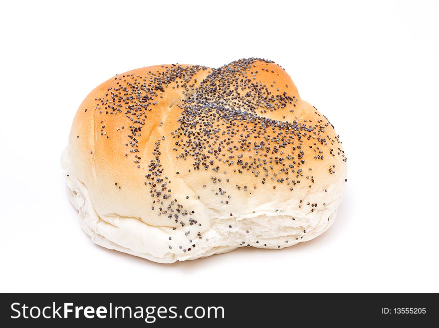 Seeded bread roll from low viewpoint isolated against white background.