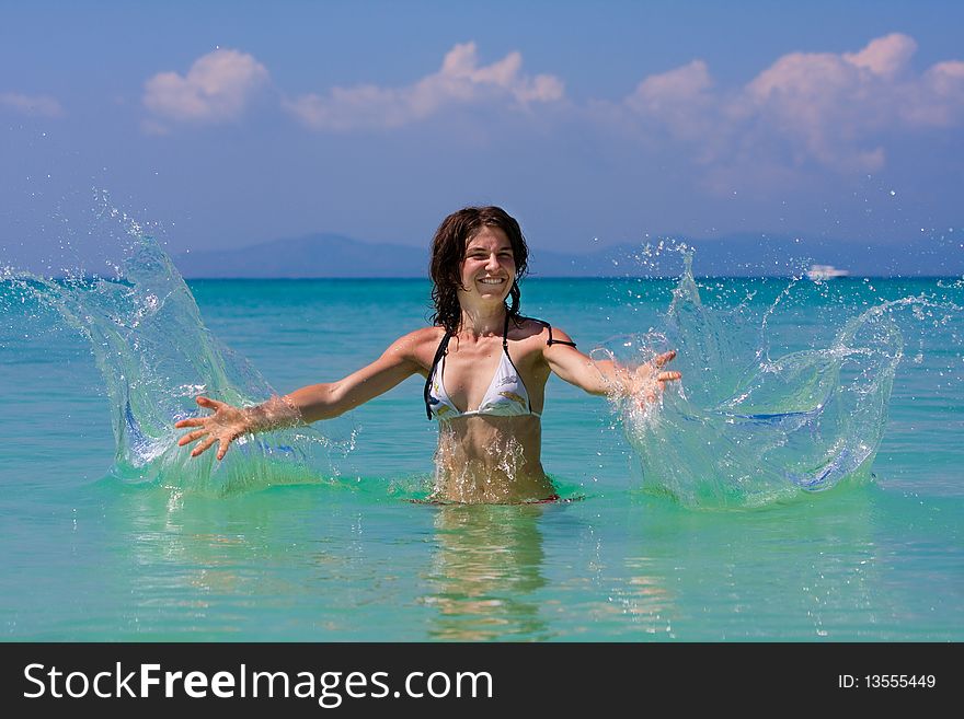 Girl with long hair playing in the sea. Girl with long hair playing in the sea