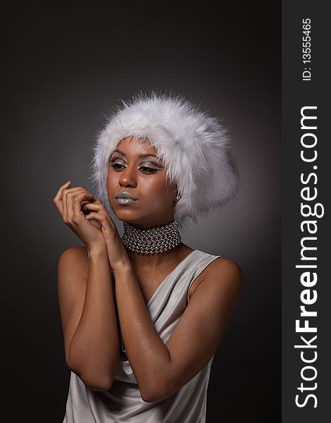 Afro-american woman portrait in big white hat