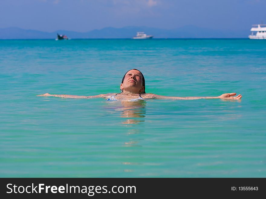 Girl with long hair playing in the sea. Girl with long hair playing in the sea